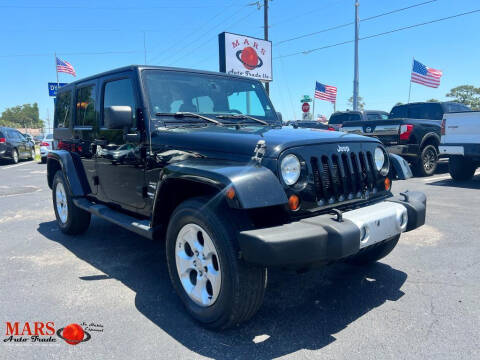 2013 Jeep Wrangler Unlimited for sale at Mars Auto Trade LLC in Orlando FL