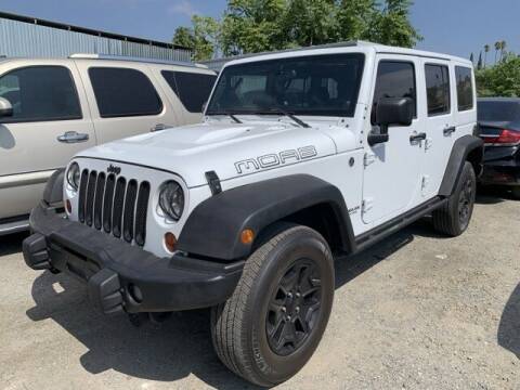 2013 Jeep Wrangler Unlimited for sale at Los Compadres Auto Sales in Riverside CA