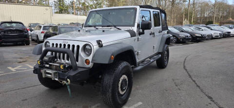 2012 Jeep Wrangler Unlimited for sale at GEORGIA AUTO DEALER LLC in Buford GA