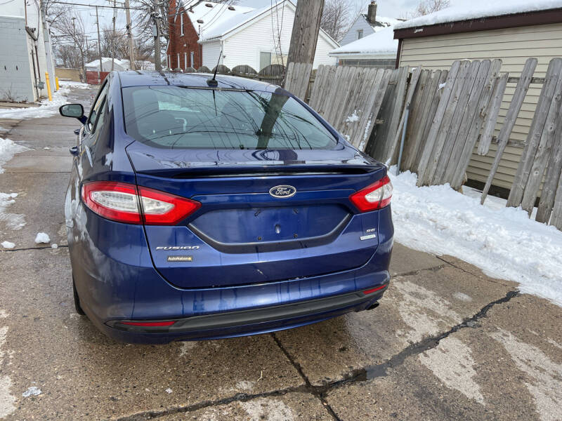 2014 Ford Fusion for sale at BRAVO AUTO EXPORT INC in Harper Woods MI