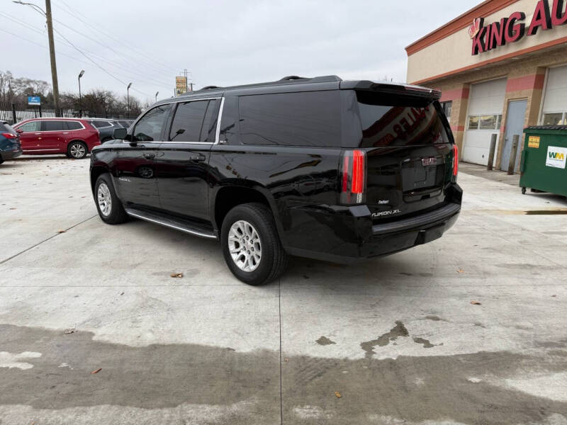 Used 2015 GMC Yukon XL SLT with VIN 1GKS2HKC3FR660129 for sale in Detroit, MI