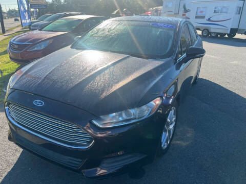 2013 Ford Fusion for sale at Cars for Less in Phenix City AL
