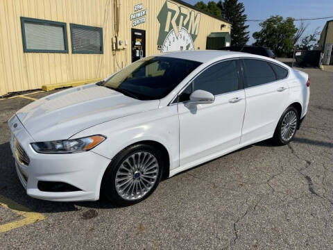 2014 Ford Fusion for sale at RPM AUTO SALES in Lansing MI