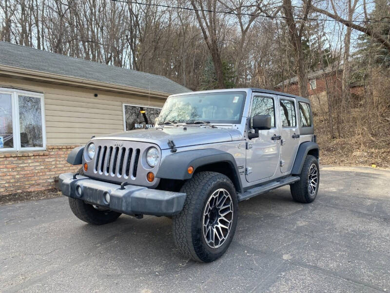 2013 Jeep Wrangler Unlimited for sale at Rams Auto Sales LLC in South Saint Paul MN