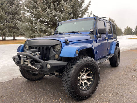 2009 Jeep Wrangler Unlimited for sale at BELOW BOOK AUTO SALES in Idaho Falls ID