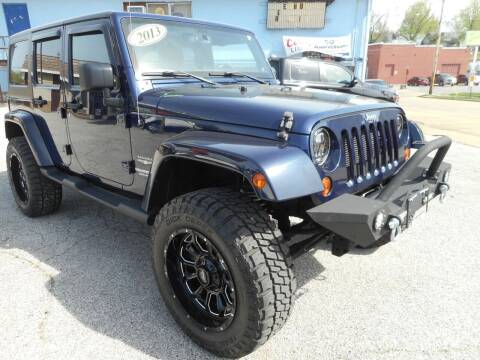 2013 Jeep Wrangler Unlimited for sale at River City Auto Center LLC in Chester IL