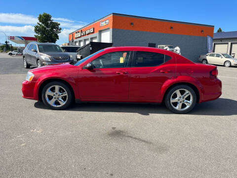 2013 Dodge Avenger for sale at Crown Motor Inc in Grand Forks ND