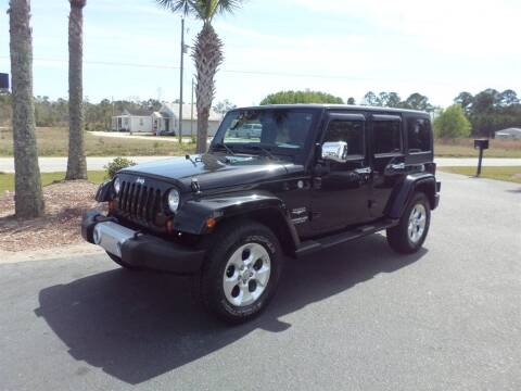 2013 Jeep Wrangler Unlimited for sale at First Choice Auto Inc in Little River SC
