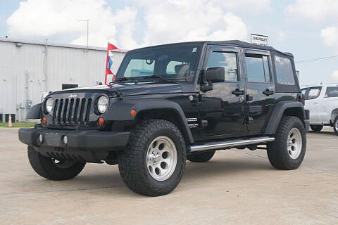 2010 Jeep Wrangler Unlimited for sale at STRICKLAND AUTO GROUP INC in Ahoskie NC