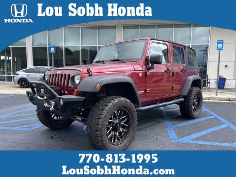 2011 Jeep Wrangler Unlimited for sale at Lou Sobh Honda in Cumming GA