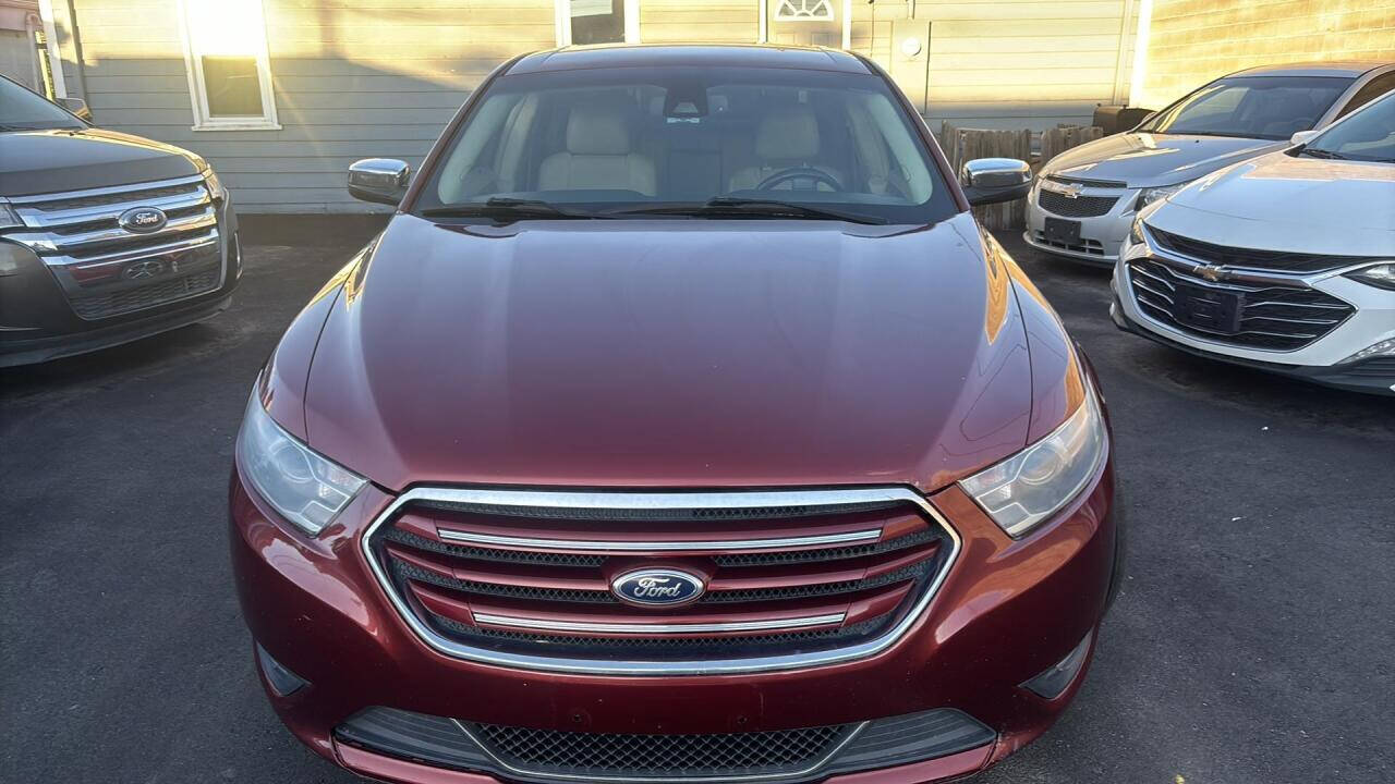 2014 Ford Taurus for sale at Ganda Auto Sales in Denver, CO