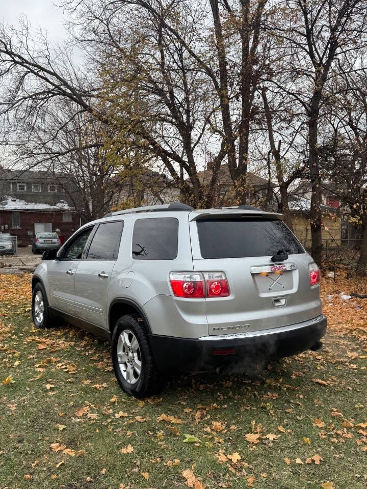 2011 GMC Acadia for sale at H & H AUTO GROUP in Detroit, MI