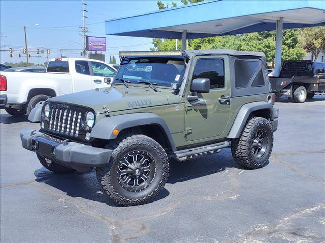 2015 Jeep Wrangler for sale at HOWERTON'S AUTO SALES in Stillwater OK