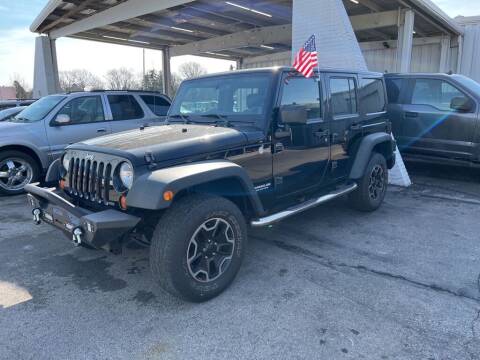 2011 Jeep Wrangler Unlimited for sale at Lakeshore Auto Wholesalers in Amherst OH