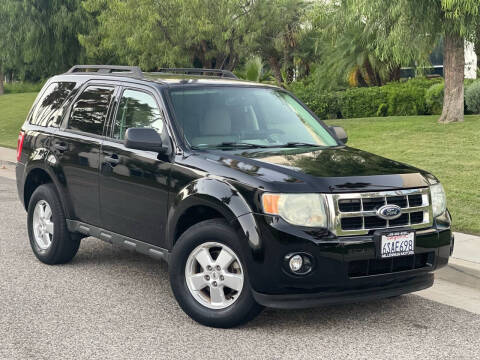 2010 Ford Escape for sale at MILLENNIUM MOTORS in Van Nuys CA