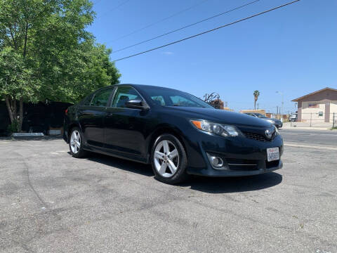 2012 Toyota Camry for sale at BARMAN AUTO INC in Bakersfield CA