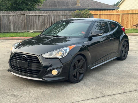 2015 Hyundai Veloster for sale at KM Motors LLC in Houston TX