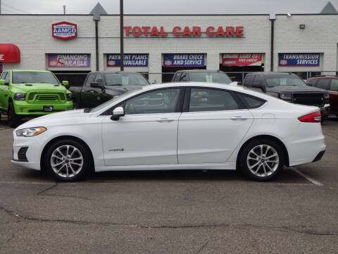2019 Ford Fusion Hybrid for sale at RAVMOTORS - CRYSTAL in Crystal MN