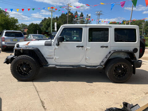 2011 Jeep Wrangler Unlimited for sale at Super Trooper Motors in Madison WI