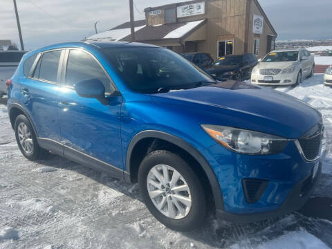 2013 Mazda CX-5 for sale at BERKENKOTTER MOTORS in Brighton CO