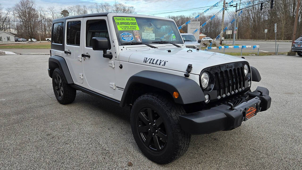 2017 Jeep Wrangler Unlimited for sale at North Ridge Auto Center LLC in Madison, OH