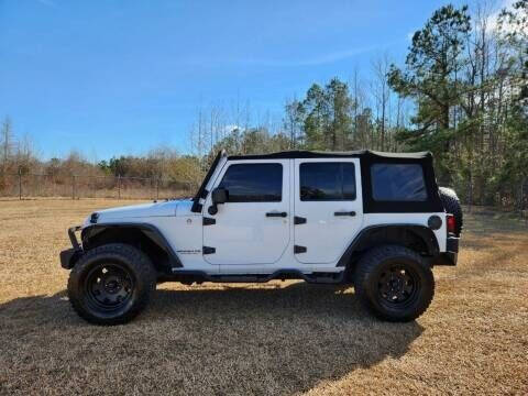 2014 Jeep Wrangler Unlimited for sale at Poole Automotive in Laurinburg NC