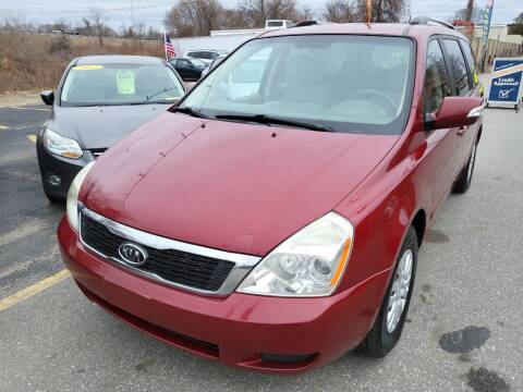 2011 Kia Sedona for sale at Howe's Auto Sales in Lowell MA