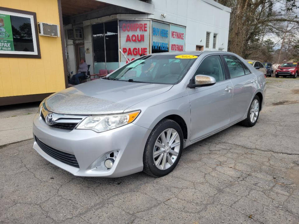 2012 Toyota Camry for sale at DAGO'S AUTO SALES LLC in Dalton, GA