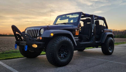 2014 Jeep Wrangler Unlimited for sale at The Motor Collection in Plain City OH