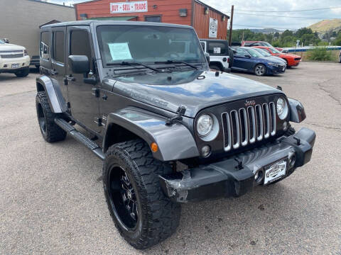 2017 Jeep Wrangler Unlimited for sale at BERKENKOTTER MOTORS in Brighton CO