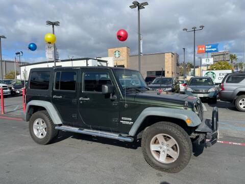 2011 Jeep Wrangler Unlimited for sale at MILLENNIUM CARS in San Diego CA