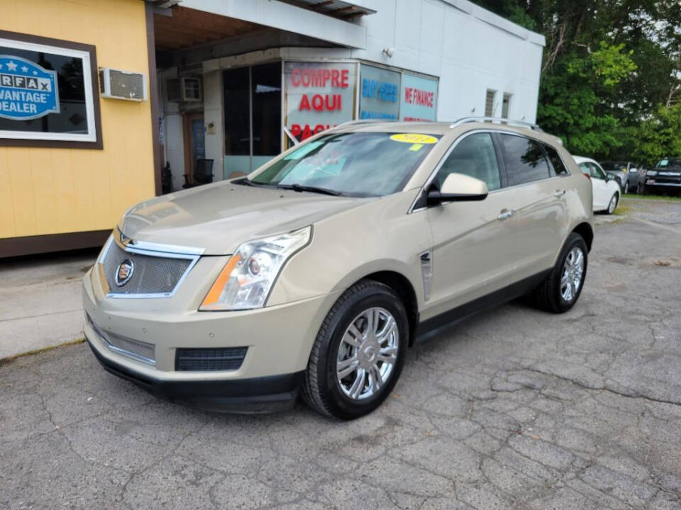 2011 Cadillac SRX for sale at DAGO'S AUTO SALES LLC in Dalton, GA