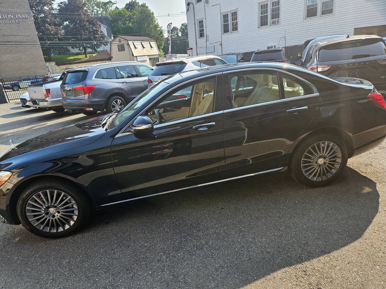 2015 Mercedes-Benz C-Class for sale at RENOS AUTO SALES LLC in Waterbury, CT