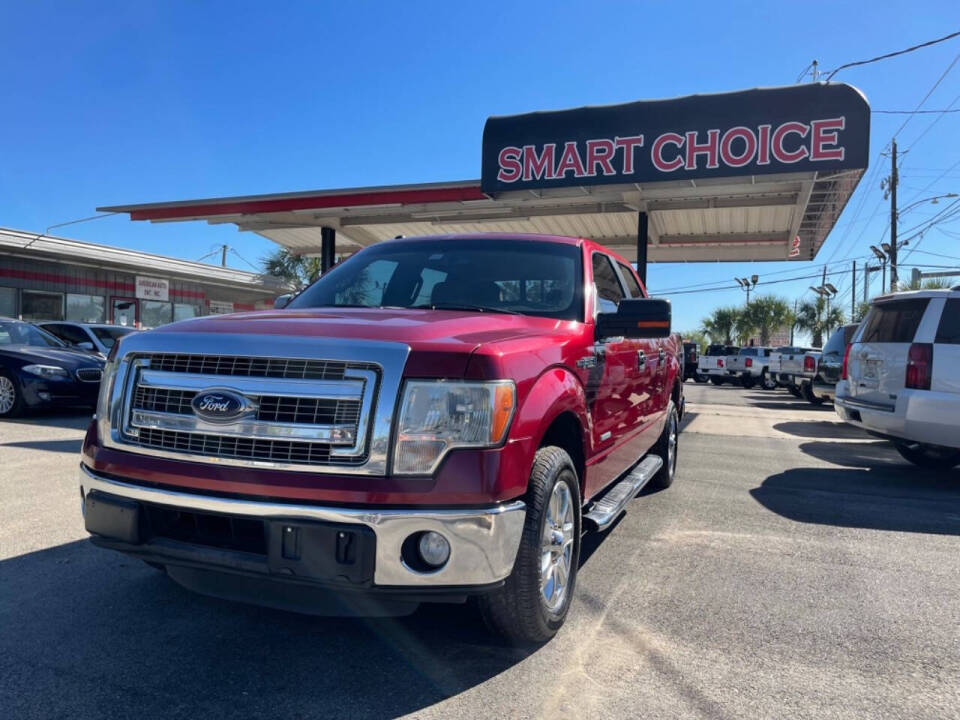 2014 Ford F-150 for sale at SMART CHOICE AUTO in Pasadena, TX