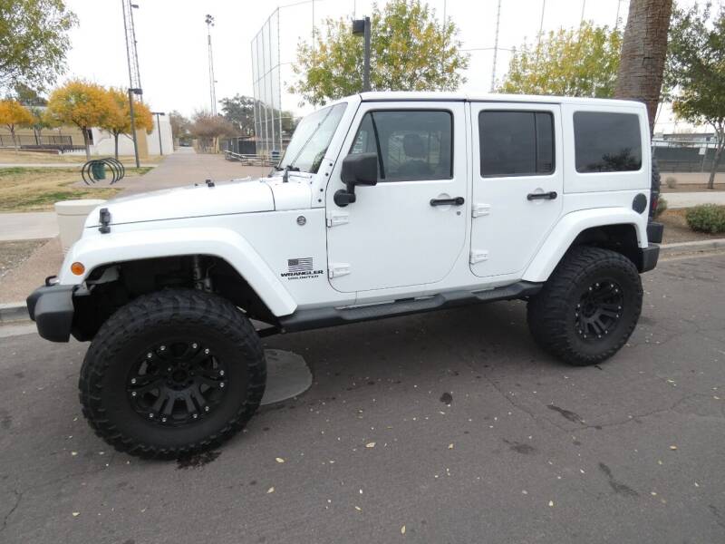 2012 Jeep Wrangler Unlimited for sale at J & E Auto Sales in Phoenix AZ