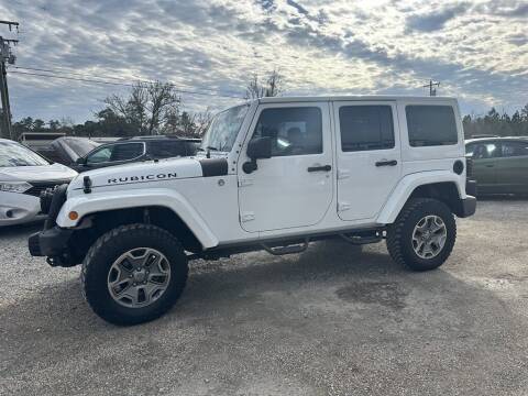 2015 Jeep Wrangler Unlimited for sale at Direct Auto in Biloxi MS