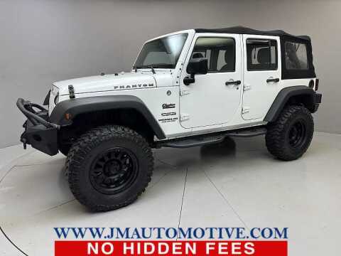 2015 Jeep Wrangler Unlimited for sale at J & M Automotive in Naugatuck CT