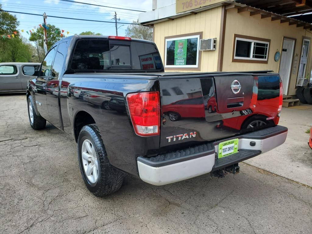 2011 Nissan Titan for sale at DAGO'S AUTO SALES LLC in Dalton, GA