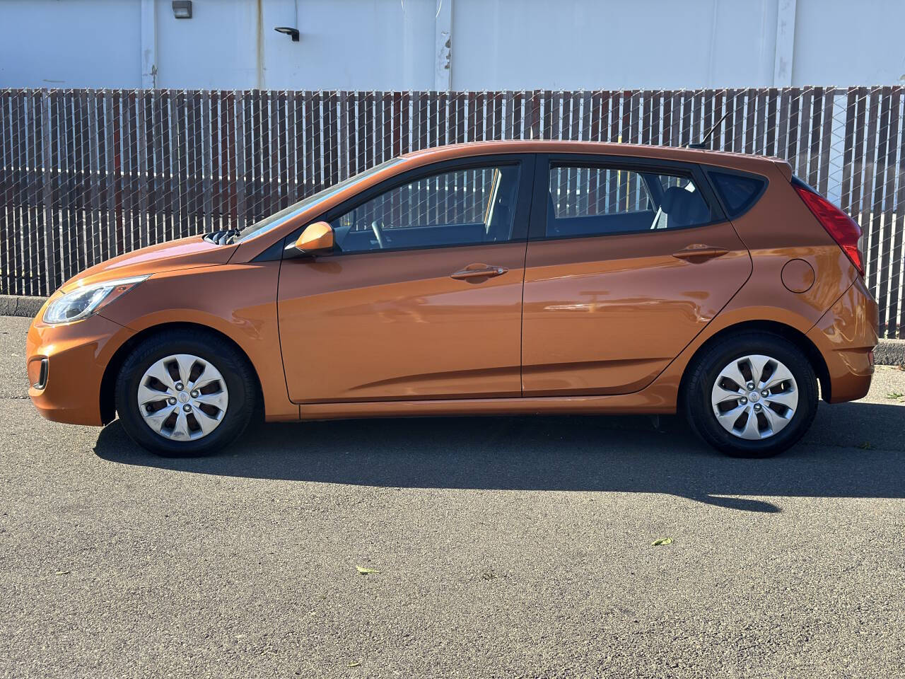 Orange 2017 Hyundai ACCENT SE SE 4dr Hatchback 6A 2