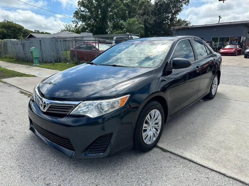 2014 Toyota Camry for sale at P J Auto Trading Inc in Orlando FL