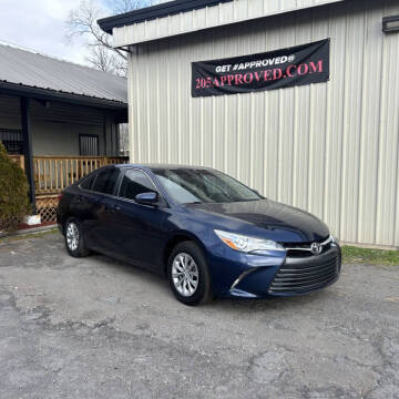 2015 Toyota Camry for sale at FIRST CLASS AUTO SALES in Bessemer AL