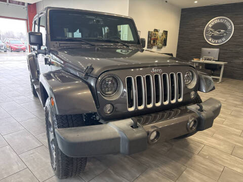 2016 Jeep Wrangler Unlimited for sale at Evolution Autos in Whiteland IN