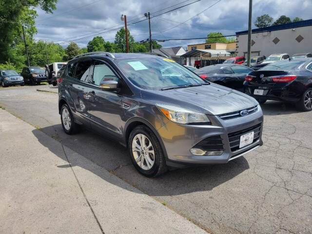 2014 Ford Escape for sale at DAGO'S AUTO SALES LLC in Dalton, GA