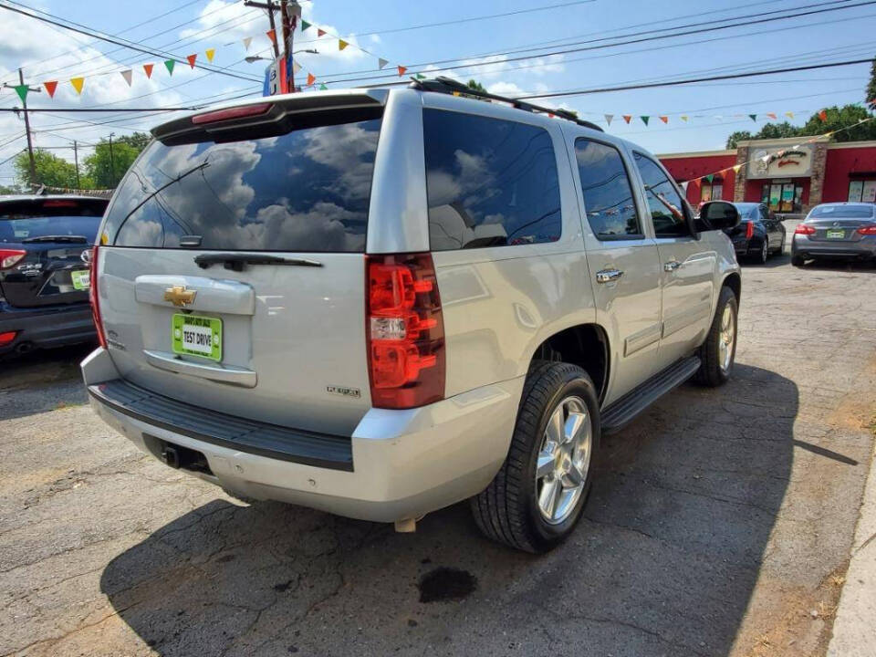 2011 Chevrolet Tahoe for sale at DAGO'S AUTO SALES LLC in Dalton, GA