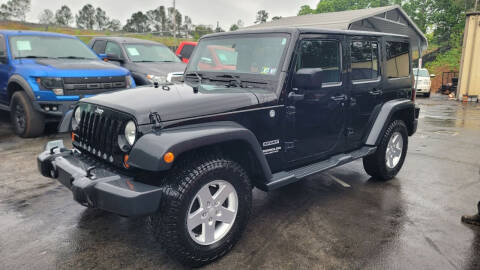 2012 Jeep Wrangler Unlimited for sale at GEORGIA AUTO DEALER LLC in Buford GA