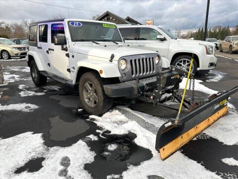 2015 Jeep Wrangler Unlimited for sale at HUFF AUTO GROUP in Jackson MI