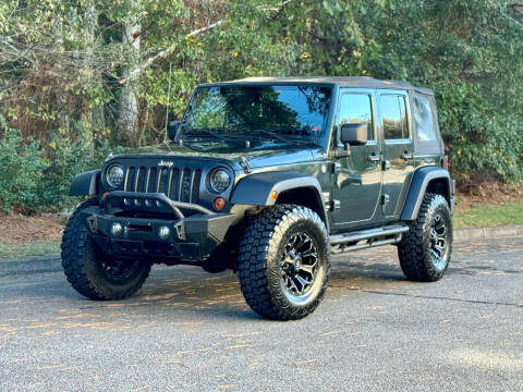 2011 Jeep Wrangler Unlimited for sale at H and S Auto Group in Canton GA