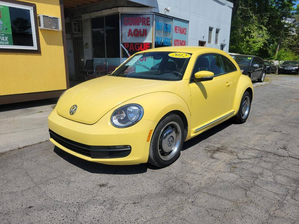 2012 Volkswagen Beetle for sale at DAGO'S AUTO SALES LLC in Dalton, GA