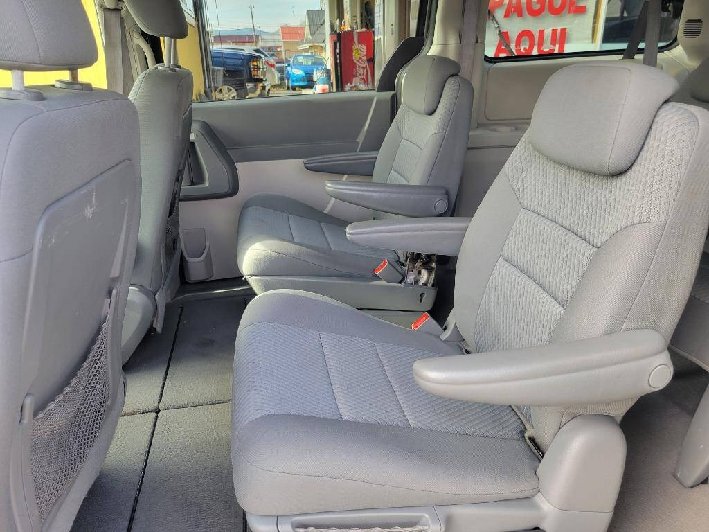 2010 Dodge Grand Caravan for sale at DAGO'S AUTO SALES LLC in Dalton, GA