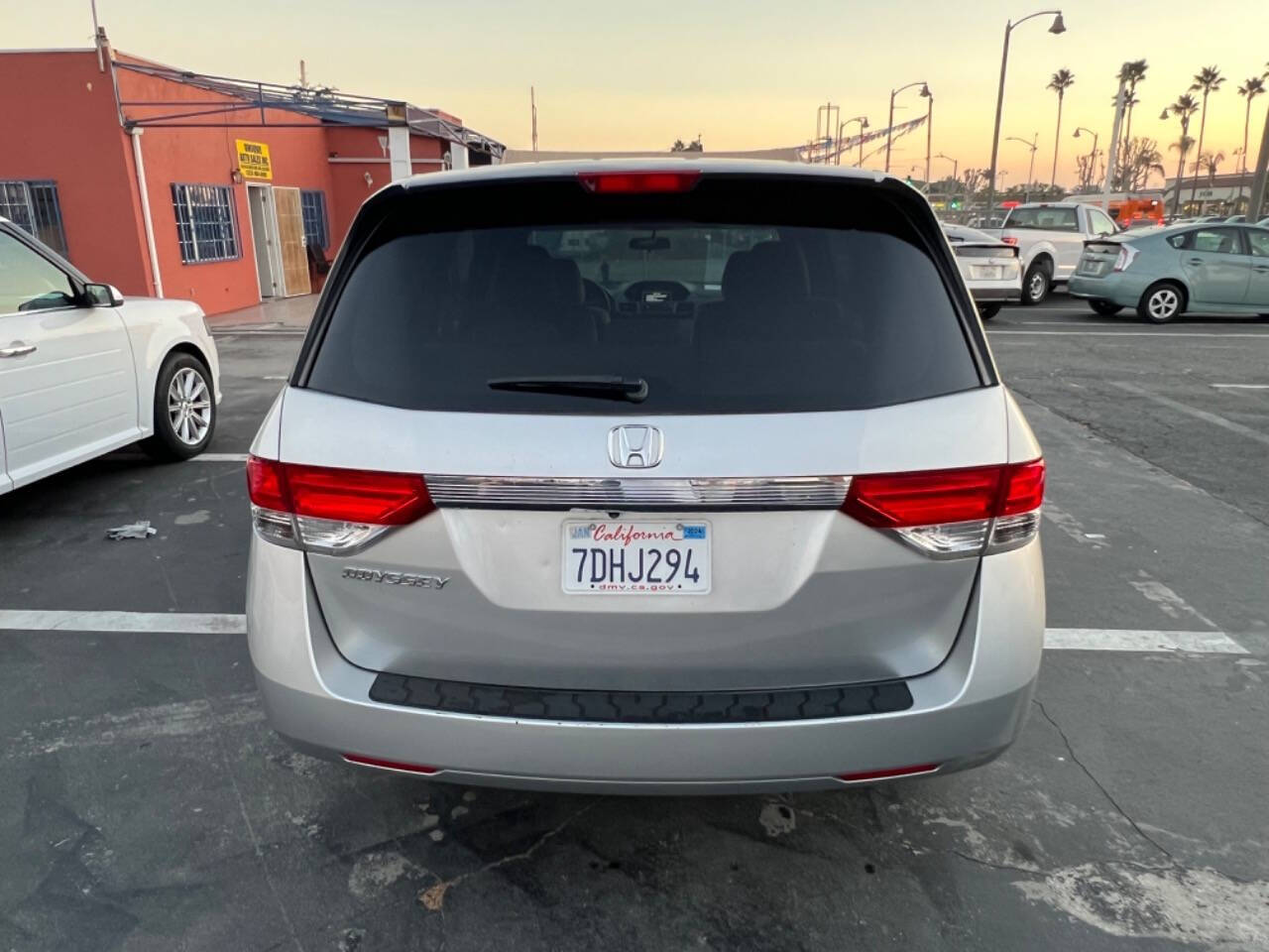 2014 Honda Odyssey for sale at Unique Auto Sales, Inc. in Bell, CA